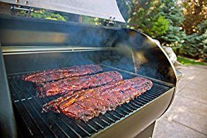 3 racks of ribs smoking in a pellet grill