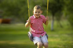 Top 10 Heavy Duty Swing Sets For Older Kids: Older Boy on a swing