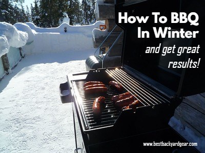 BBQ cooking meat on a snowy deck